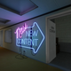 A large neon sign points players toward the door for New Content.